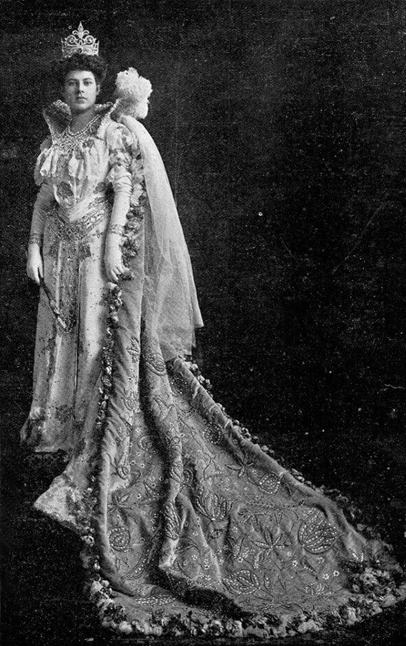 Adrienne Claiborne, the founder of Pointe Coupee Parish Library, in an elegant dress and crown.