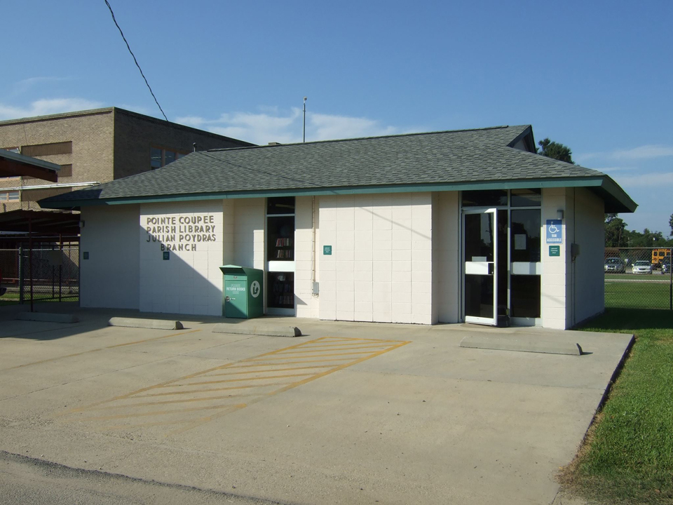 The parking lot and front exterior of the Pointe Coupee Julian Poydras branch.