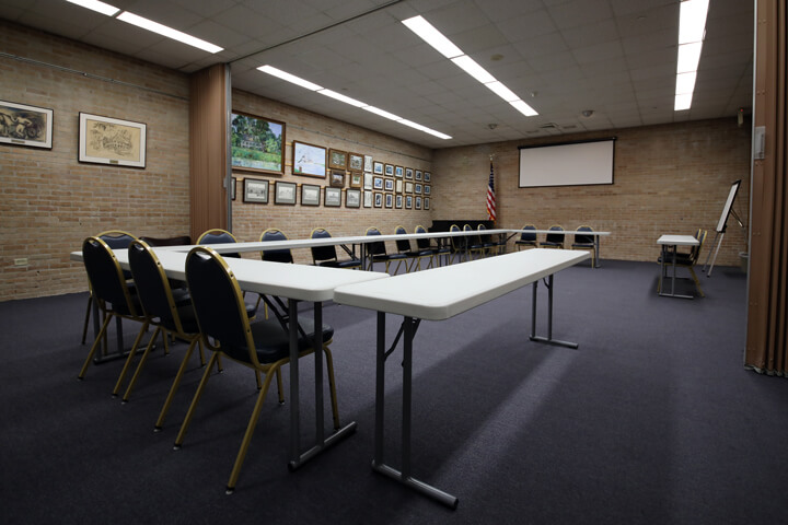 A spacious Pointe Coupee Library meeting room in New Roads with a U-shape table layout.